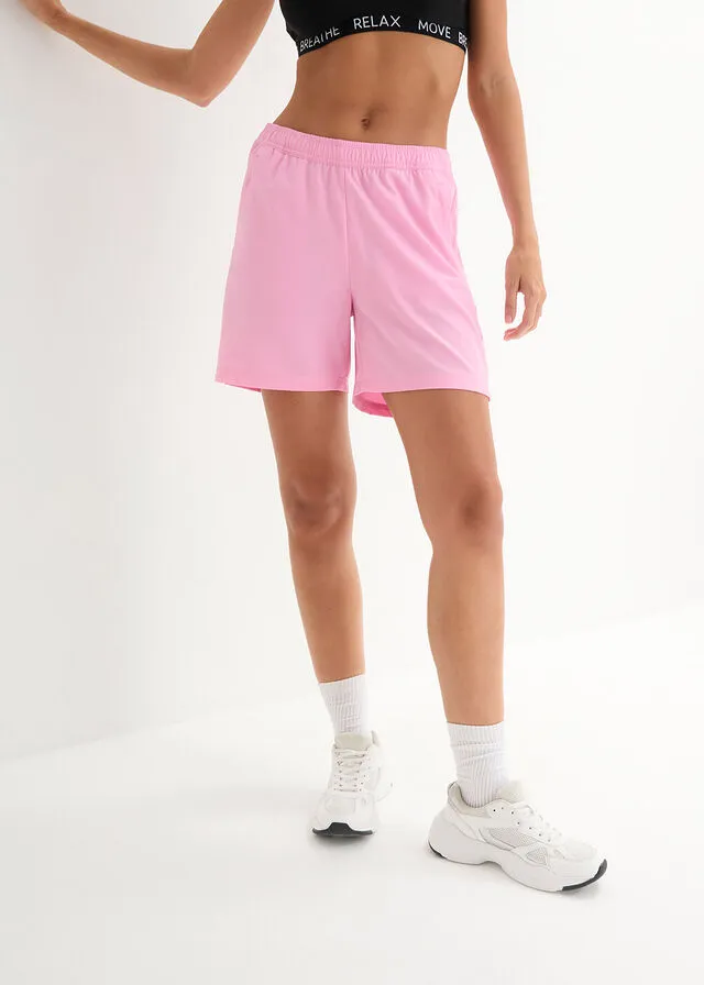 Pantalón deportivo de secado rápido con bolsillos con cremallera, hasta el tobillo Rosa